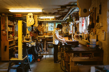 Craftsman working in guitar making workshop Stock Photo - Premium Royalty-Free, Code: 6126-09204884