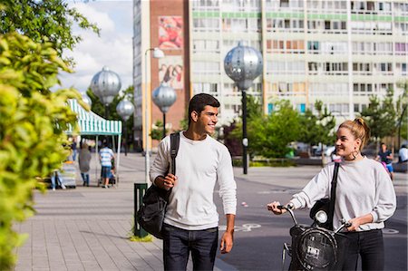 two people walking in the street