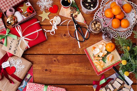Directly above shot of food and Christmas decorations on wooden table Stock Photo - Premium Royalty-Free, Code: 6127-08688151