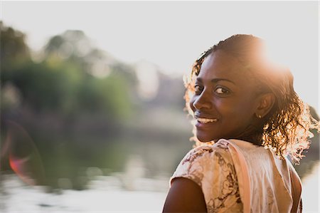 simsearch:6128-08727668,k - Portrait of a mid-adult woman standing by a river. Stock Photo - Premium Royalty-Free, Code: 6128-08747471