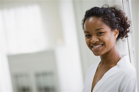 salon african american - Portrait of a smiling young woman Stock Photo - Premium Royalty-Free, Code: 6128-08747569