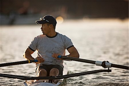 rowing oar - Mid-adult man sea rowing Stock Photo - Premium Royalty-Free, Code: 6128-08747668