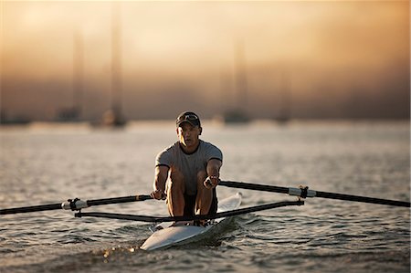 simsearch:6128-08747668,k - Mid-adult man sea rowing Stock Photo - Premium Royalty-Free, Code: 6128-08747669