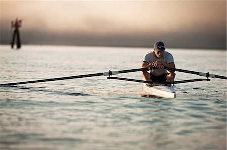 simsearch:6128-08747668,k - Mid-adult man sea rowing Stock Photo - Premium Royalty-Free, Code: 6128-08747674