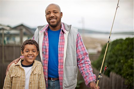 simsearch:6128-08728311,k - Father and son prepare to go fishing. Photographie de stock - Premium Libres de Droits, Code: 6128-08747802