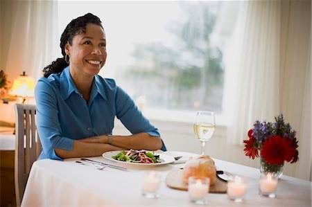 simsearch:6128-08747963,k - Mature woman sitting at dinner table and smiling Stock Photo - Premium Royalty-Free, Code: 6128-08747972