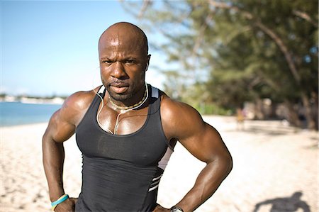 strong depth of field - Muscular man on the beach. Stock Photo - Premium Royalty-Free, Code: 6128-08747982