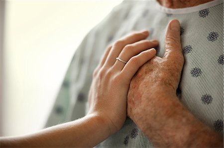 elderly not illustration not monochrome and two people assistance not illustration not monochrome and two people - Young woman comforting an elderly man in the hospital. Stock Photo - Premium Royalty-Free, Code: 6128-08748173