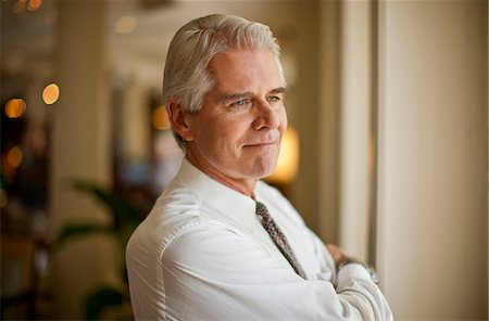 simsearch:694-03330980,k - Mature businessman looking away thoughtfully. Stock Photo - Premium Royalty-Free, Code: 6128-08748130