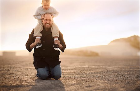 simsearch:6128-08825403,k - Father and son having fun together on a beach. Stock Photo - Premium Royalty-Free, Code: 6128-08766611