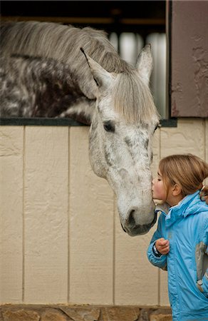 simsearch:6128-08766768,k - Loving young girl giving her horse a kiss on the nose. Foto de stock - Sin royalties Premium, Código: 6128-08766756