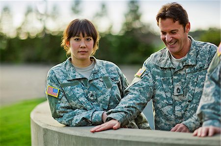 Portrait of two US Army soldiers relaxing together after a training exercise. Stock Photo - Premium Royalty-Free, Code: 6128-08766706