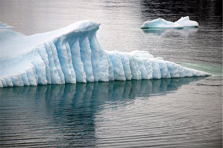 Natural patterns on an iceberg are reflected in the sea. Stock Photo - Premium Royalty-Free, Code: 6128-08766842