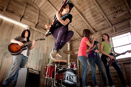 female singer guitar - Teenagers having fun together practising in their band. Stock Photo - Premium Royalty-Free, Code: 6128-08766810