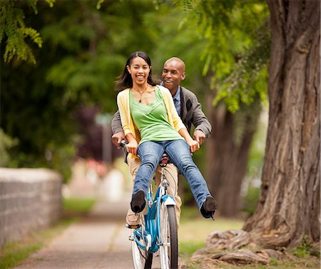 simsearch:700-03865247,k - Young couple playfully riding a bicycle. Stock Photo - Premium Royalty-Free, Code: 6128-08767050