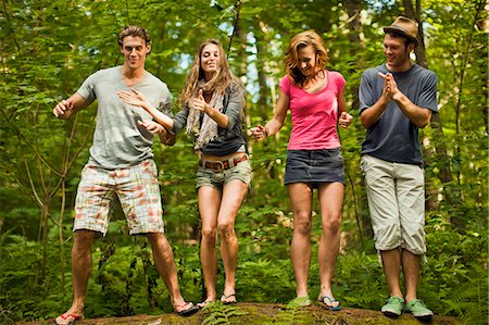 simsearch:649-07437610,k - Friends dancing in a forest. Photographie de stock - Premium Libres de Droits, Code: 6128-08767085