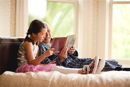 sick girl in bed - Senior man reading a story with his granddaughter. Stock Photo - Premium Royalty-Free, Code: 6128-08767033