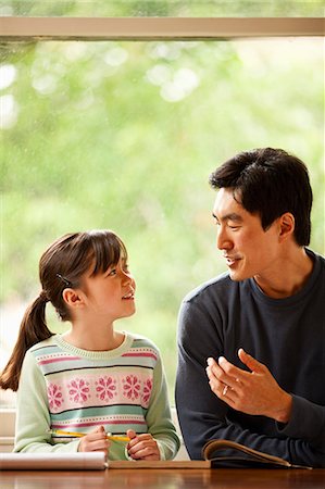 simsearch:6128-08798764,k - Father helping his daughter with homework. Stock Photo - Premium Royalty-Free, Code: 6128-08767035