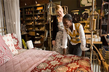 Couple looking at bed in store Stock Photo - Premium Royalty-Free, Code: 6128-08780506