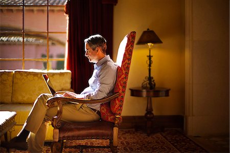 study (room) - Man working on laptop in his opulent home. Stock Photo - Premium Royalty-Free, Code: 6128-08780612
