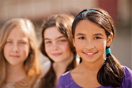 south american ethnicity - Three girls standing in a row. Stock Photo - Premium Royalty-Free, Code: 6128-08780623