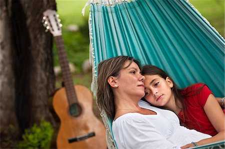 Young girl lying on a hammock with her mother in the country. Stock Photo - Premium Royalty-Free, Code: 6128-08780778