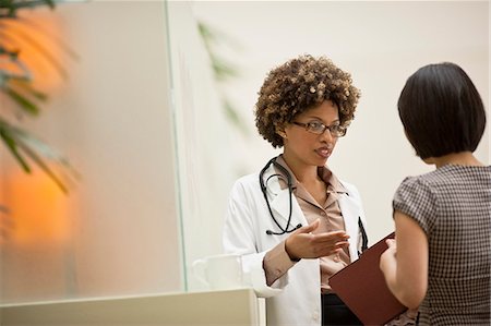 problem - Female doctor talking to patient. Stock Photo - Premium Royalty-Free, Code: 6128-08780904