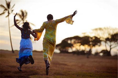 Two women running together. Stock Photo - Premium Royalty-Free, Code: 6128-08780921