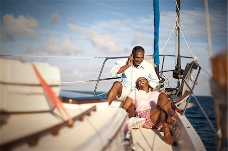 Mature couple relaxing together on boat deck in the sunshine. Stock Photo - Premium Royalty-Free, Code: 6128-08780926