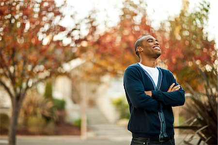 simsearch:6128-08781051,k - Portrait of laughing mid-adult man. Foto de stock - Royalty Free Premium, Número: 6128-08781048