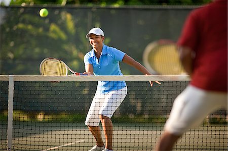 Couple playing tennis Photographie de stock - Premium Libres de Droits, Code: 6128-08798970