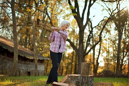 simsearch:6109-08399054,k - Woman chopping wood. Stock Photo - Premium Royalty-Free, Code: 6128-08799107