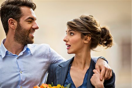 simsearch:6128-08728169,k - Happy young business couple walk together during their lunch break. Stock Photo - Premium Royalty-Free, Code: 6128-08727685
