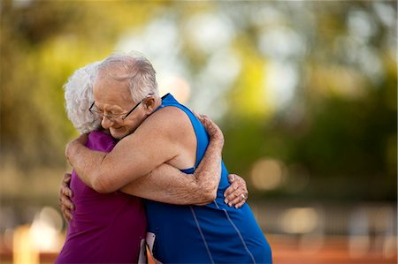 simsearch:600-03738693,k - Loving senior couple embracing after an athletics event. Stock Photo - Premium Royalty-Free, Code: 6128-08727862