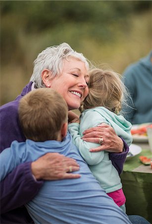 simsearch:640-03256069,k - Affectionate grandmother hugs her young grandchildren. Stock Photo - Premium Royalty-Free, Code: 6128-08728027