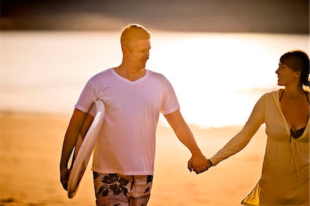 simsearch:6128-08728347,k - Middle aged couple walking hand in hand on the beach. Stock Photo - Premium Royalty-Free, Code: 6128-08728177