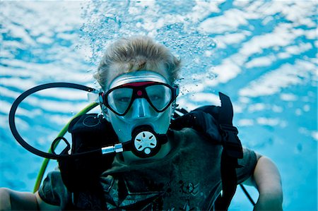 simsearch:614-08865495,k - Young boy learning how to scuba dive in a pool. Stock Photo - Premium Royalty-Free, Code: 6128-08728110