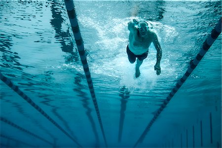 simsearch:6128-08728124,k - Mature man swimming laps at his local pool. Stock Photo - Premium Royalty-Free, Code: 6128-08728130