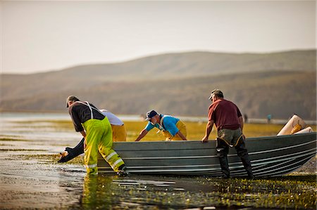 friends fishing on boat - Group of fisherman preparing to go out in their boat. Stock Photo - Premium Royalty-Free, Code: 6128-08728272