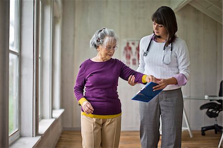 strong depth of field - Elderly woman at a medical check-up with her doctor. Stock Photo - Premium Royalty-Free, Code: 6128-08728215