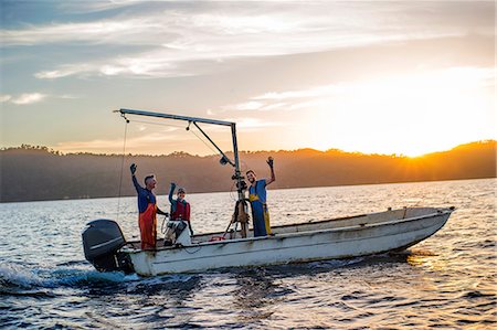 Family operating their fishing boat. Stock Photo - Premium Royalty-Free, Code: 6128-08728429