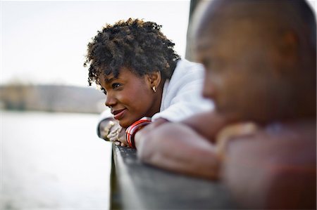 Couple lying on wharf together. Stock Photo - Premium Royalty-Free, Code: 6128-08737754