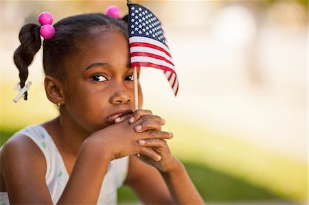 simsearch:6128-08737851,k - Portrait of a young girl holding an American flag. Stockbilder - Premium RF Lizenzfrei, Bildnummer: 6128-08737839