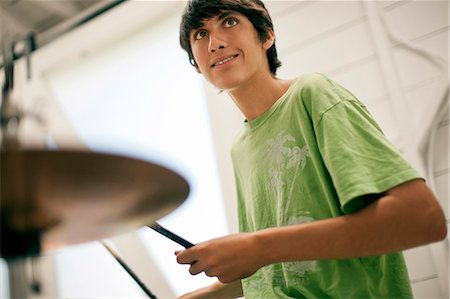 simsearch:6128-08737935,k - Teenage boy playing the drums. Stock Photo - Premium Royalty-Free, Code: 6128-08737943