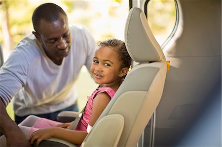 portrait of kids ballet dancers - Young girl dressed as a ballerina sitting in a car. Stock Photo - Premium Royalty-Free, Code: 6128-08737996