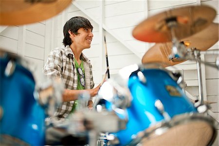 simsearch:6128-08737935,k - Teenage boy playing on a drum kit. Stock Photo - Premium Royalty-Free, Code: 6128-08737921