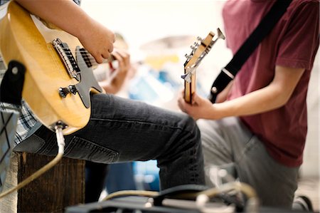 simsearch:6128-08737935,k - Two teenage boys playing their electric guitars. Stock Photo - Premium Royalty-Free, Code: 6128-08737932