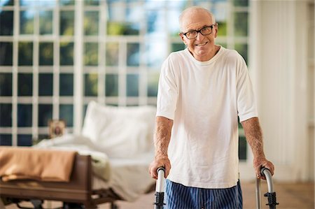 simsearch:6128-08738145,k - Portrait of an elderly man who is excited to be up and about using his walker. Stock Photo - Premium Royalty-Free, Code: 6128-08738071