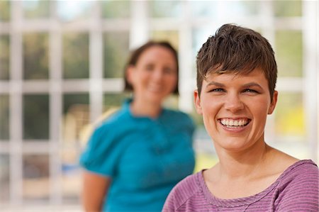 Portrait of a smiling mid adult woman. Stock Photo - Premium Royalty-Free, Code: 6128-08738164