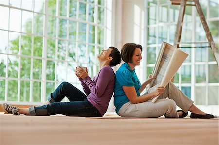 Mid adult couple bonding in their new home. Stock Photo - Premium Royalty-Free, Code: 6128-08738166